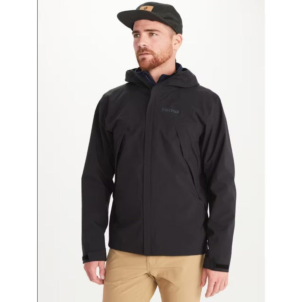 A front view of the Marmot Men's PreCip Eco Pro Jacket in Black on a model wearing khaki pants against a white background.