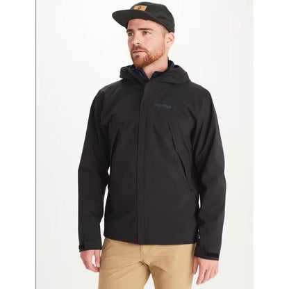 A front view of the Marmot Men's PreCip Eco Pro Jacket in Black on a model wearing khaki pants against a white background.