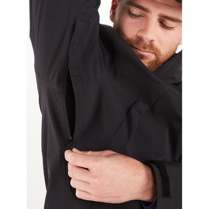 A man models the Marmot Men's PreCip Eco Pro Jacket in Black, showing the zipper detail from a close-up side angle.
