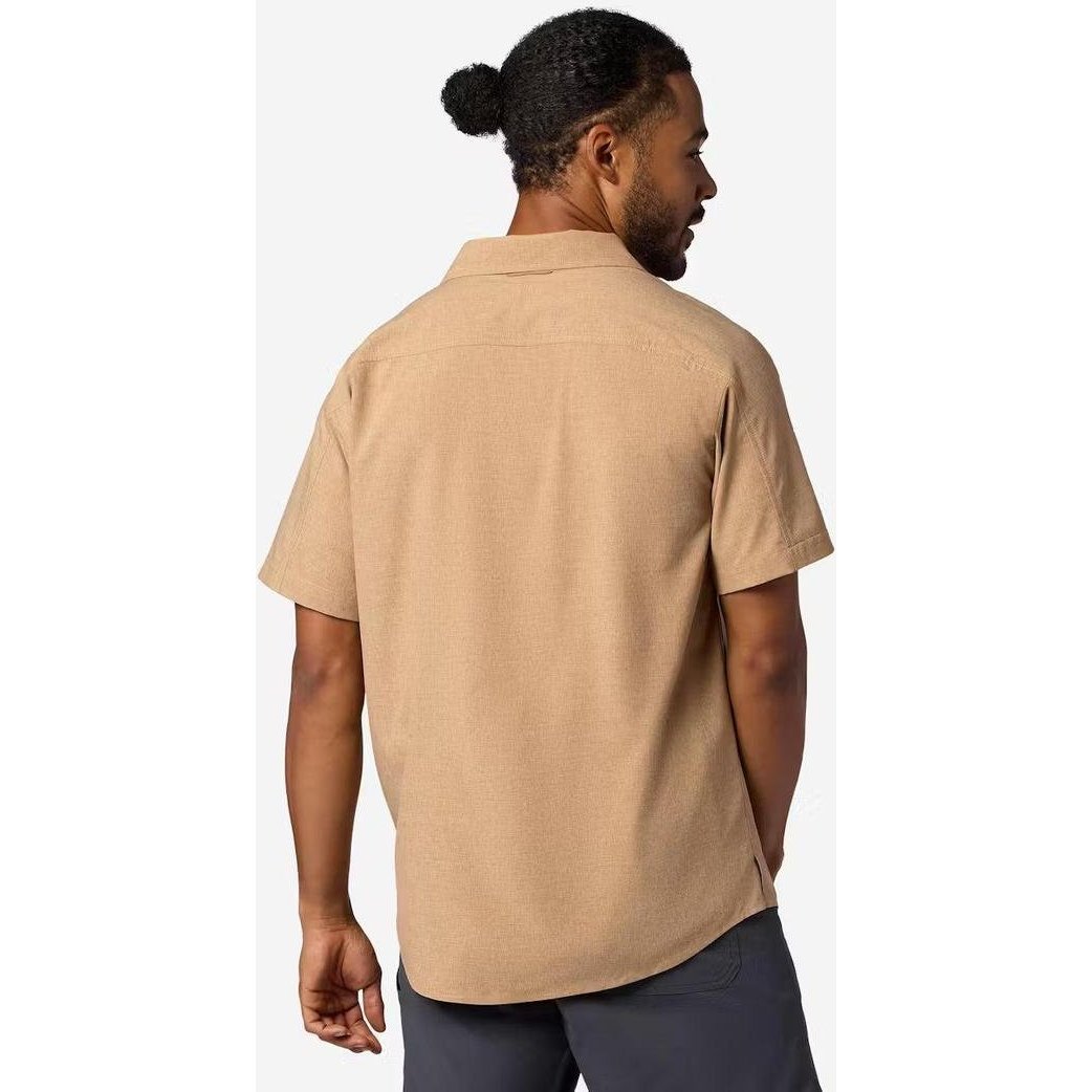 Back view of the Marmot Men's Spring Creek Short Sleeve in DromedaryHeathe on a model against a white background.