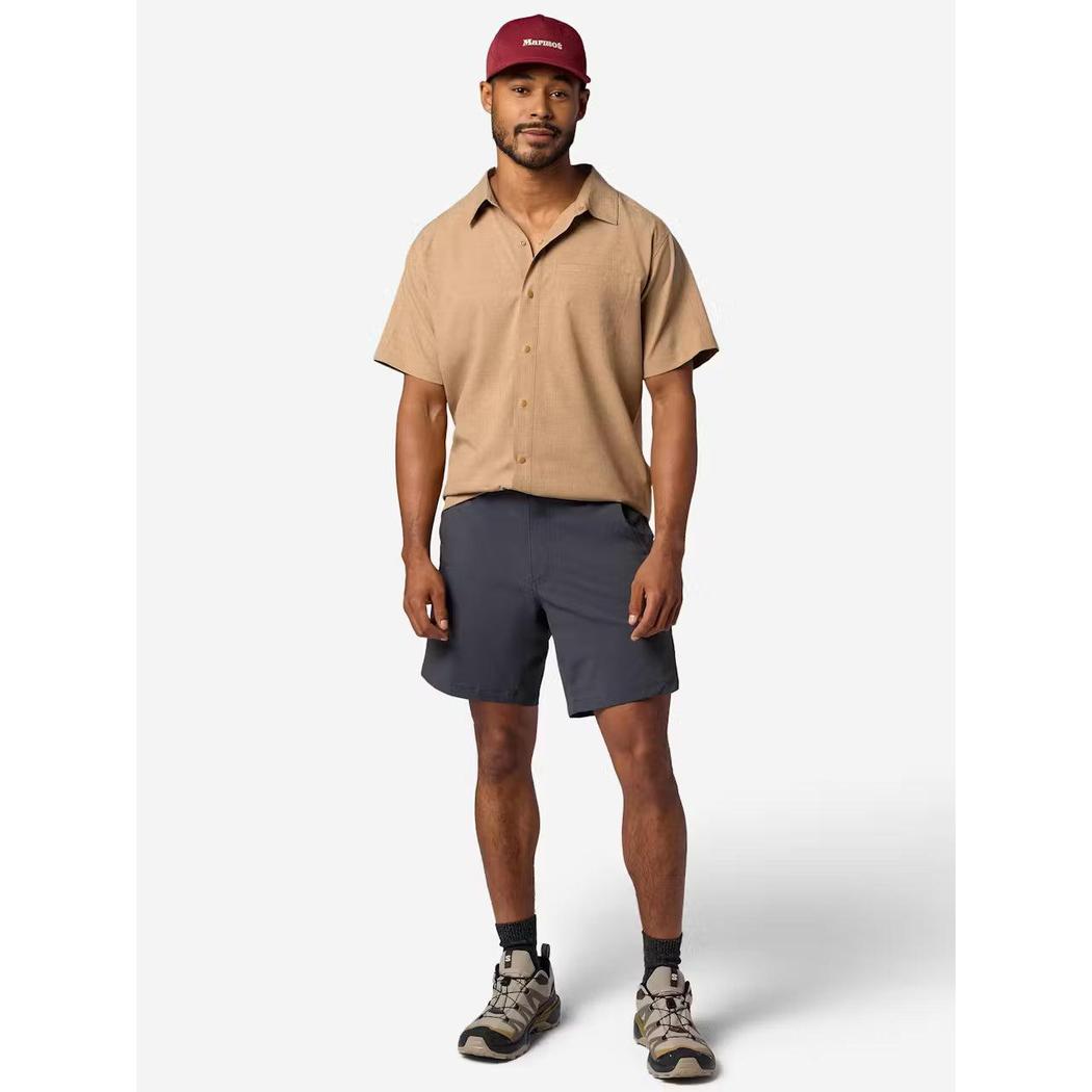 A model wearing the Marmot Men's Spring Creek Short Sleeve in DromedaryHeathe stands against a plain white background.
