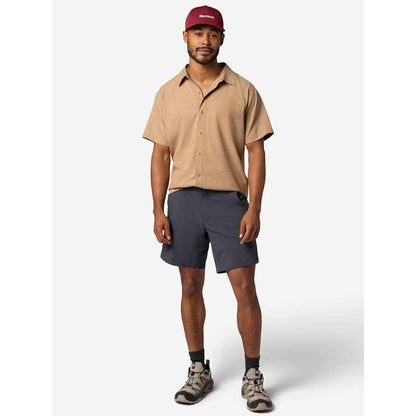 A model wearing the Marmot Men's Spring Creek Short Sleeve in DromedaryHeathe stands against a plain white background.