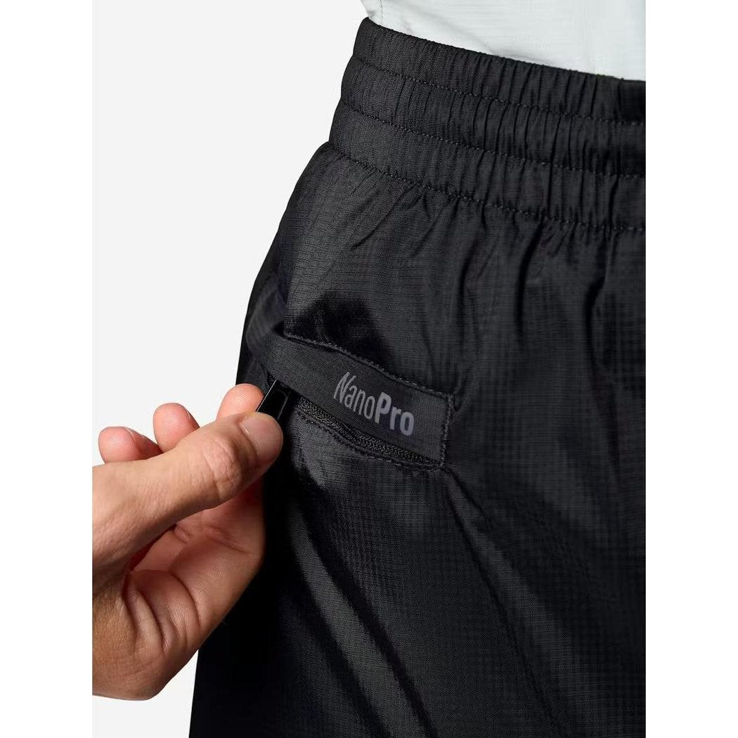 A close-up of the Marmot Women's PreCip Evo Pant in Black showing the NanoPro label on the pocket against a white background.
