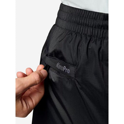 A close-up of the Marmot Women's PreCip Evo Pant in Black showing the NanoPro label on the pocket against a white background.