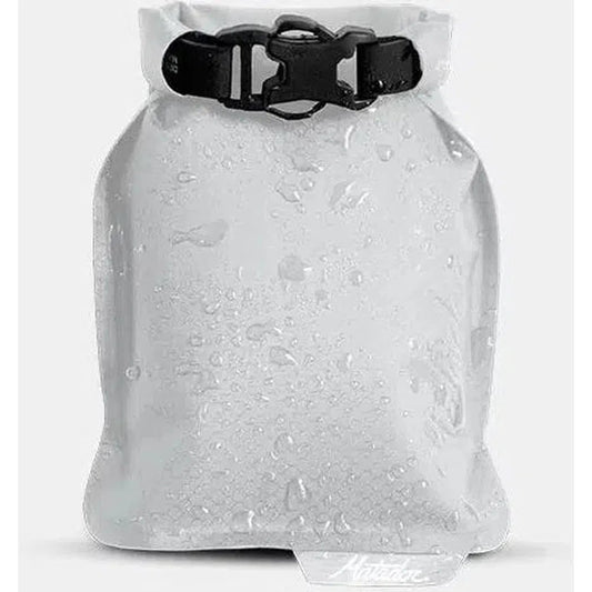 A front view of the Matador FlatPak Soap Bar Case in Arctic showing water droplets on the surface against a white background.
