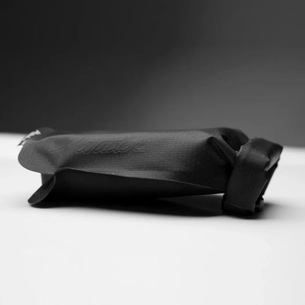 A close-up side view of the Matador FlatPak Soap Bar Case in Arctic color on a white surface with a dark background.