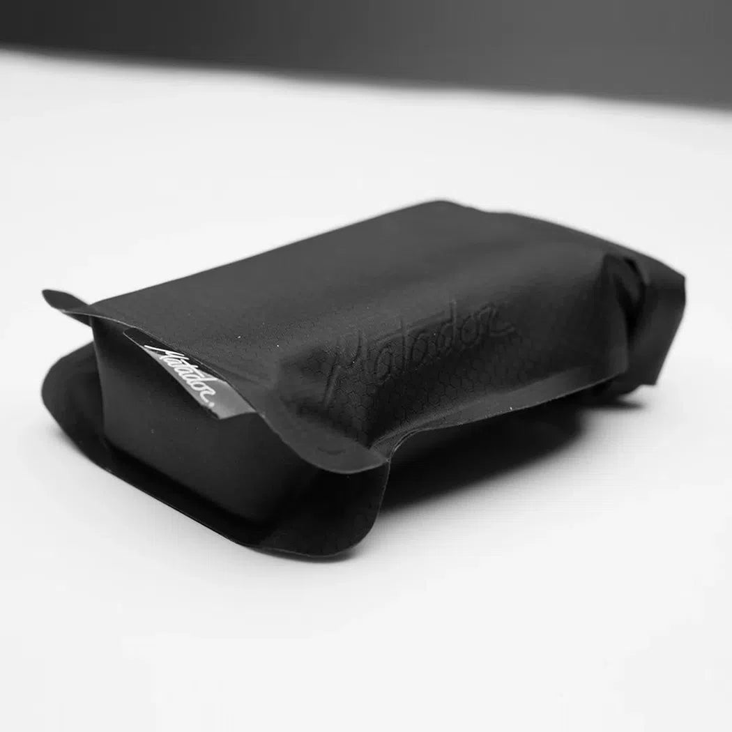 A top-down view of the Matador FlatPak Soap Bar Case in Arctic color, showing its compact design on a white surface.