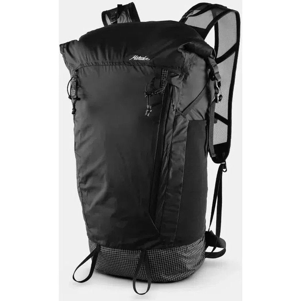 A front view of the Matador Freerain 22 Waterproof Packable Backpack in Black with mesh shoulder straps and a checkered bottom panel.