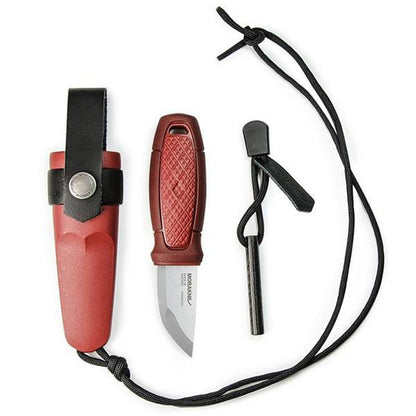 A side view of the Morakniv Eldris Knife Kit in Black showing the knife, sheath, and fire starter against a white background.
