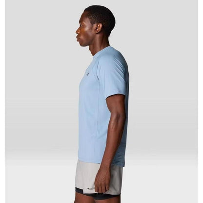 Side view of the Mountain Hardwear Men's Crater Lake Short Sleeve in Element color on a model against a light gray background.
