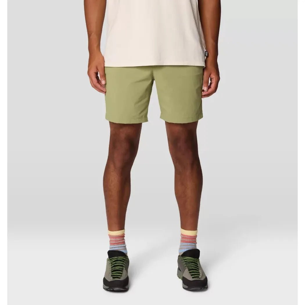A front view of the Mountain Hardwear Men's Dynama Short in Light Cactus on a model wearing green hiking shoes against a plain background.
