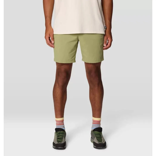 A front view of the Mountain Hardwear Men's Dynama Short in Light Cactus on a model wearing green hiking shoes against a plain background.