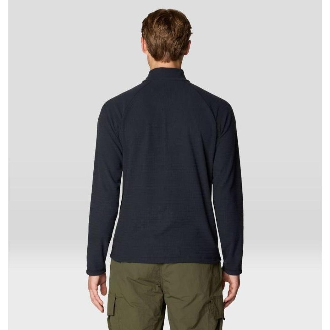 Back view of the Mountain Hardwear Men's Summit Grid Half Zip in Black on a model wearing olive cargo pants against a light gray background.