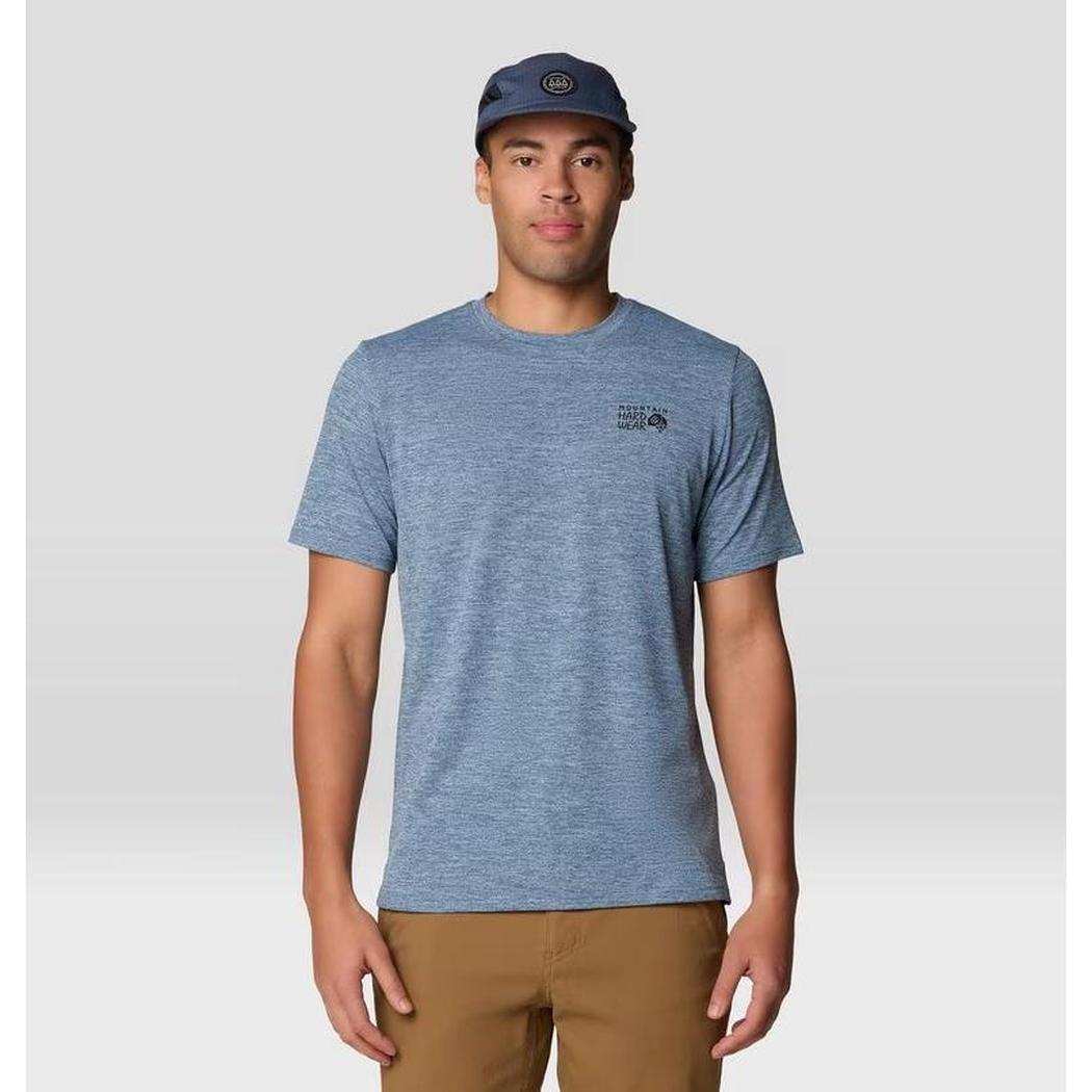 A front view of the Mountain Hardwear Men's Sunblocker Short Sleeve in Adriatic Blue Heather on a model wearing khaki pants against a light gray background.