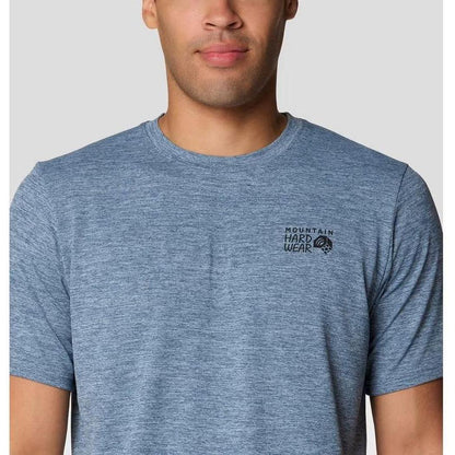 A front view of the Mountain Hardwear Men's Sunblocker Short Sleeve in Adriatic Blue Heather on a model against a light gray background.