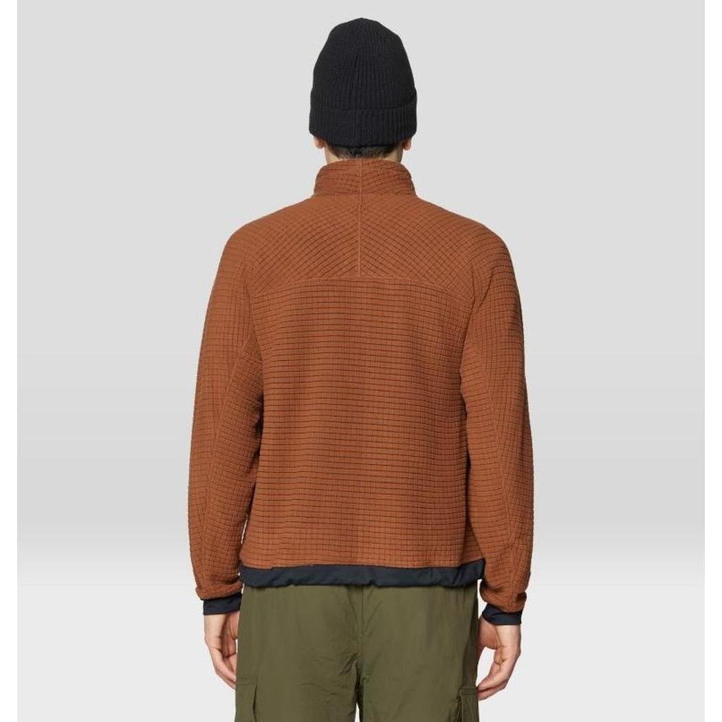 Back view of the Mountain Hardwear Summit Grid Big Grid Half Zip in Cocoa Brown on a model wearing olive pants and a black beanie against a light background.