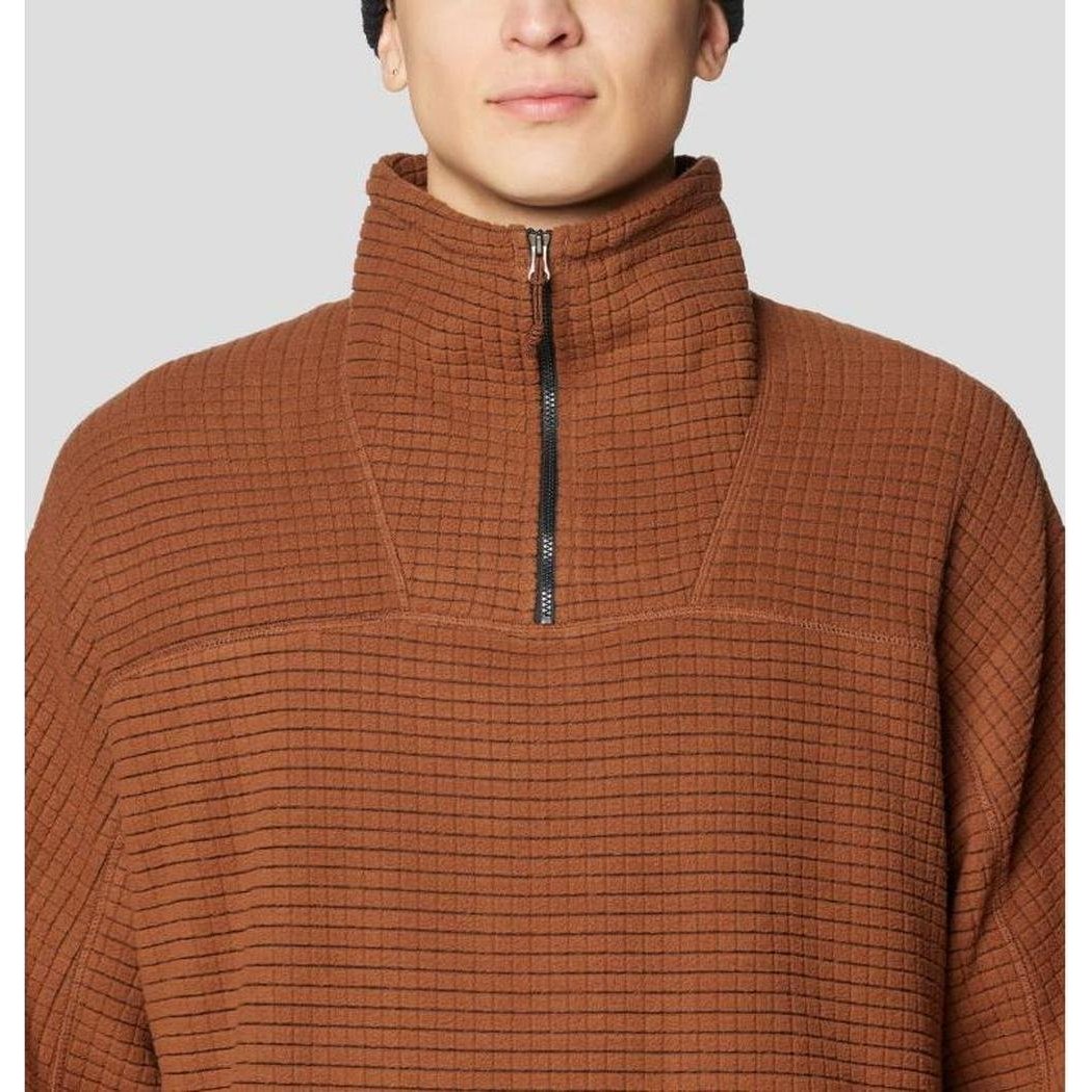 A front view of the Mountain Hardwear Summit Grid Big Grid Half Zip in Cocoa Brown showing the half zip and high collar against a light gray background.