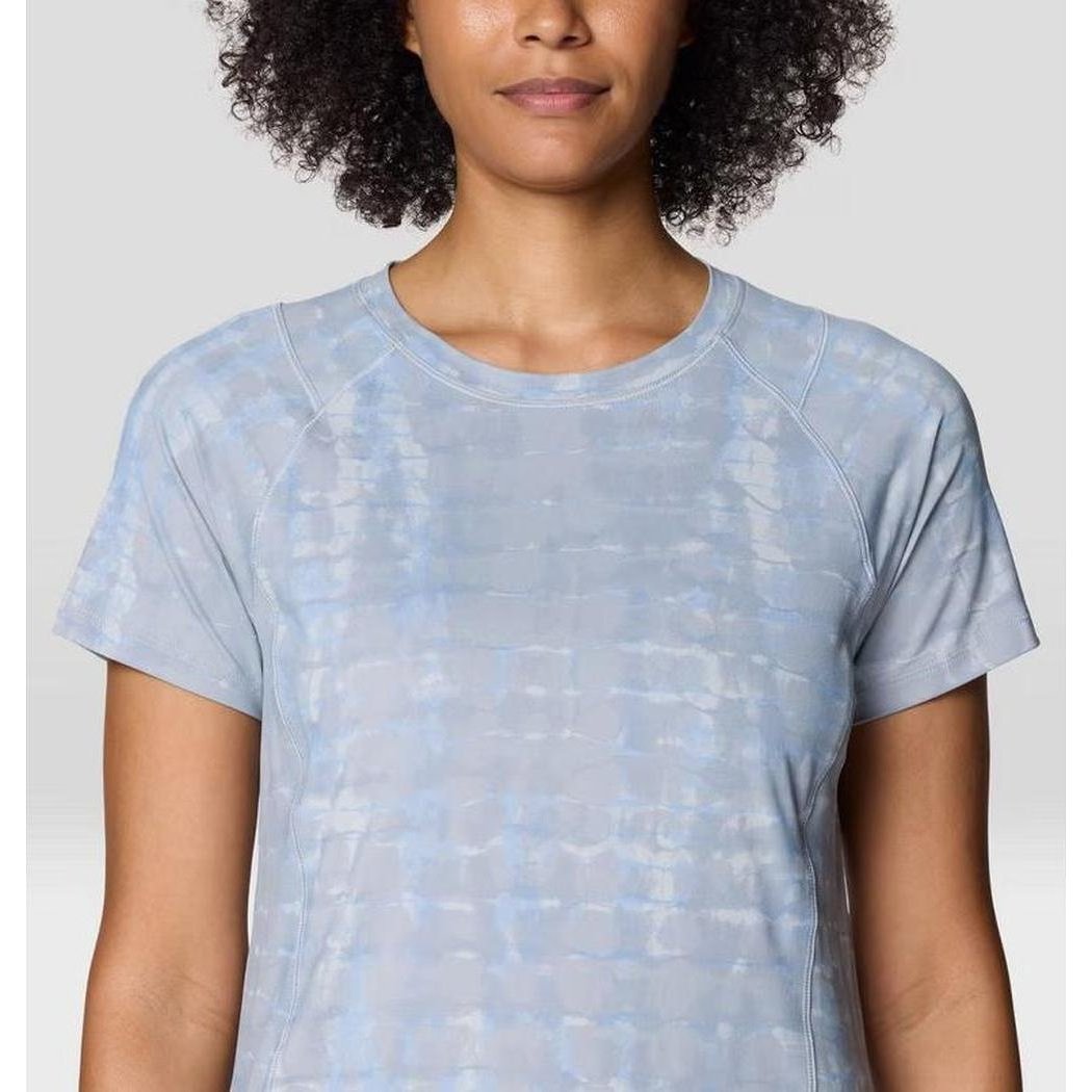 A front view of the Mountain Hardwear Women's Crater Lake Short Sleeve in Glacial Prismatic Print on a model with a light gray background.