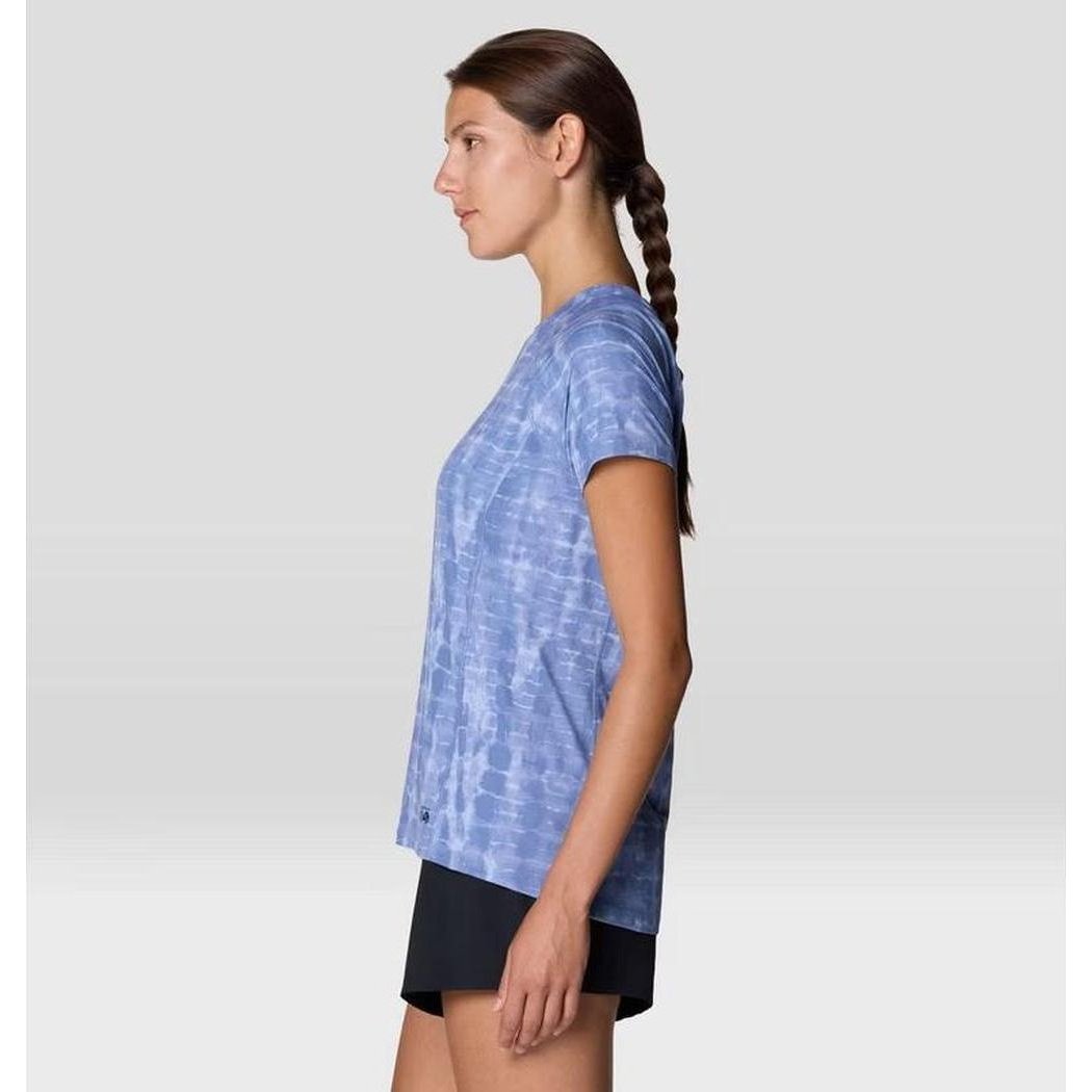 Side view of the Mountain Hardwear Women's Crater Lake Short Sleeve in Glacial Prismatic Print on a model against a light background.