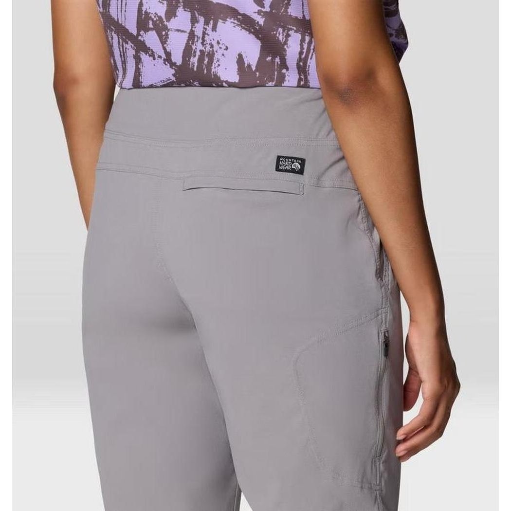 Back view of the Mountain Hardwear Women's Dynama Ankle Pant in Black showing the back pocket and model wearing it.
