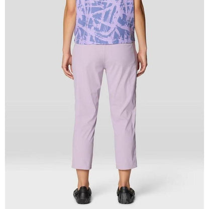 Back view of the Mountain Hardwear Women's Dynama Crop in Atmospheric, showing cropped fit and model wearing black shoes against a plain background.
