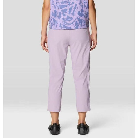 Back view of the Mountain Hardwear Women's Dynama Crop in Atmospheric, showing cropped fit and model wearing black shoes against a plain background.