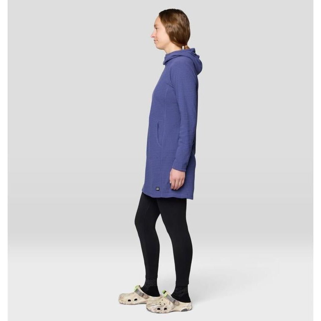 Side view of the Mountain Hardwear Women's Summit Grid Dress in Bourbon Brown on a model against a light gray background.