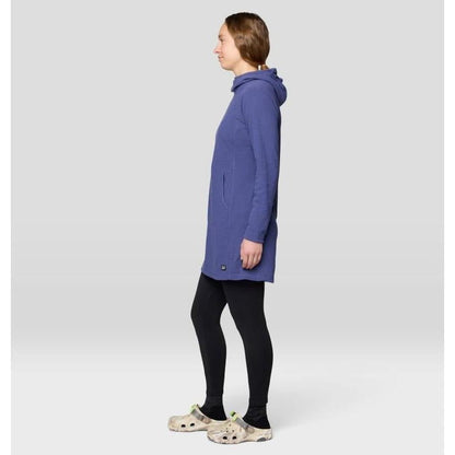 Side view of the Mountain Hardwear Women's Summit Grid Dress in Bourbon Brown on a model against a light gray background.