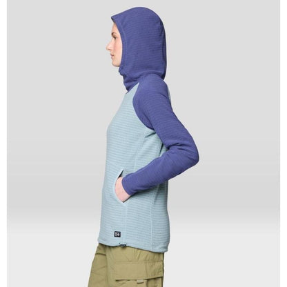 Side view of the Mountain Hardwear Women's Summit Grid Tunic Hoody in Ice Shadow/Lapis Dusk showing the hood and pocket against a light background.