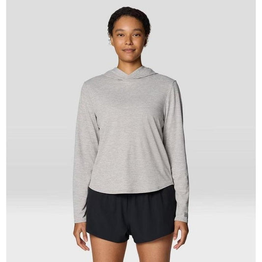 A model wearing the Mountain Hardwear Women's Sunblocker Long Sleeve Hoody in Half Moon Grey stands against a plain background.