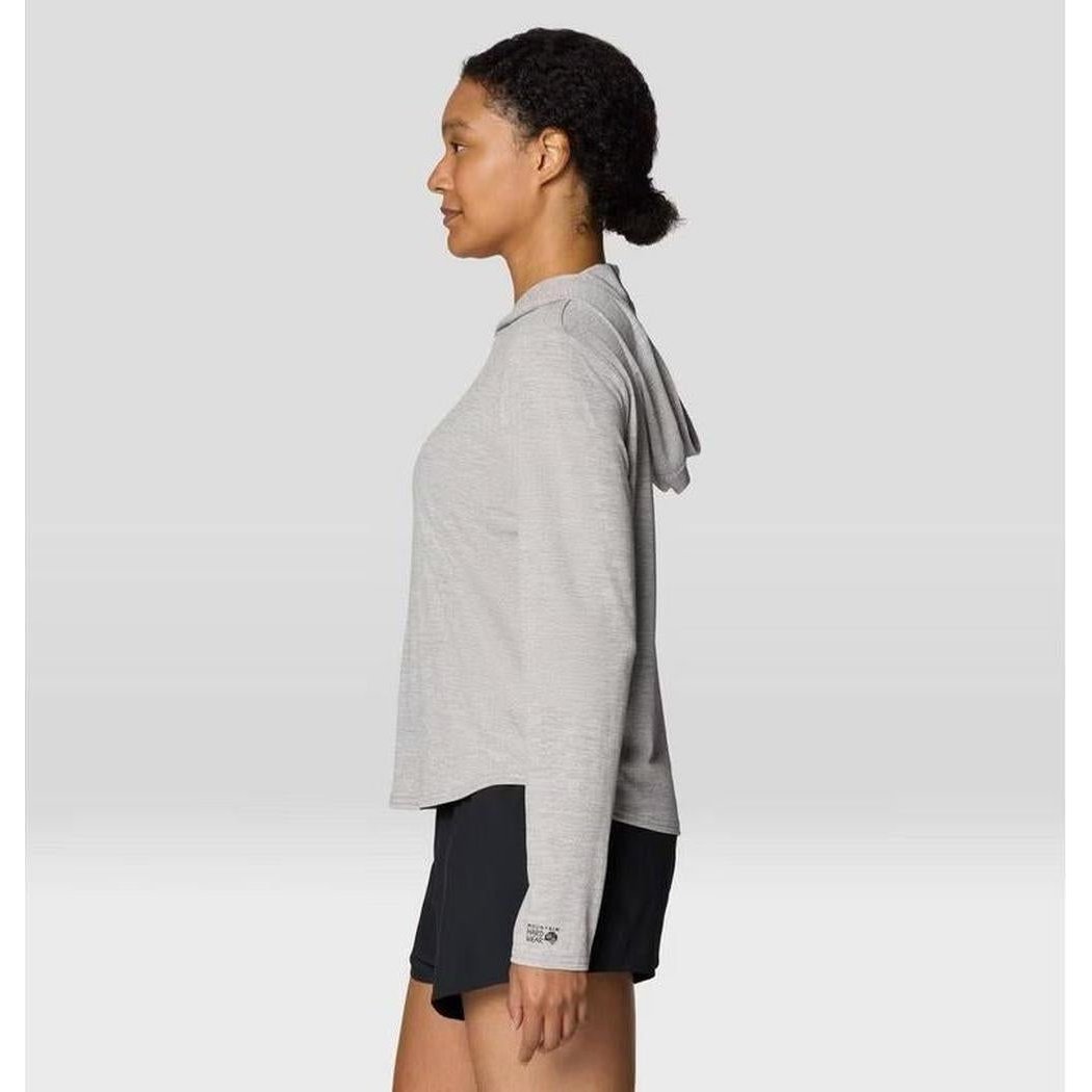 Side view of the Mountain Hardwear Women's Sunblocker Long Sleeve Hoody in Half Moon Grey on a model against a light background.