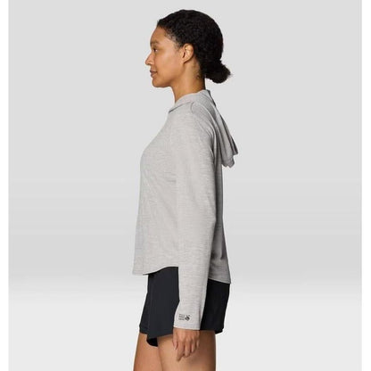 Side view of the Mountain Hardwear Women's Sunblocker Long Sleeve Hoody in Half Moon Grey on a model against a light background.