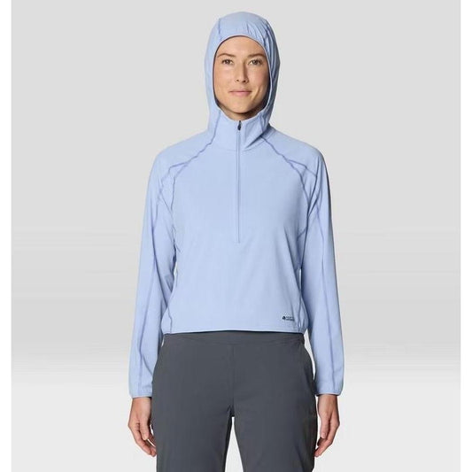 A front view of the Mountain Hardwear Women's Sunshield Hoody in Beach Breeze on a model wearing charcoal pants against a light background.
