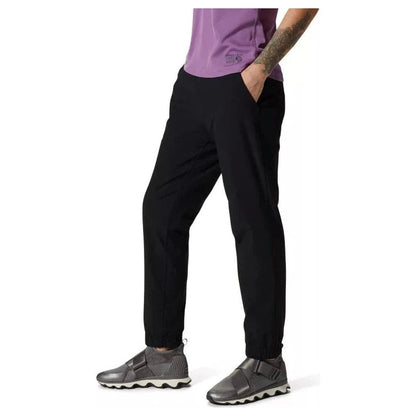 Side view of the Mountain Hardwear Women's Yumalina Active Pull-On Lined Jogger in Black, showing the model wearing it against a white background.