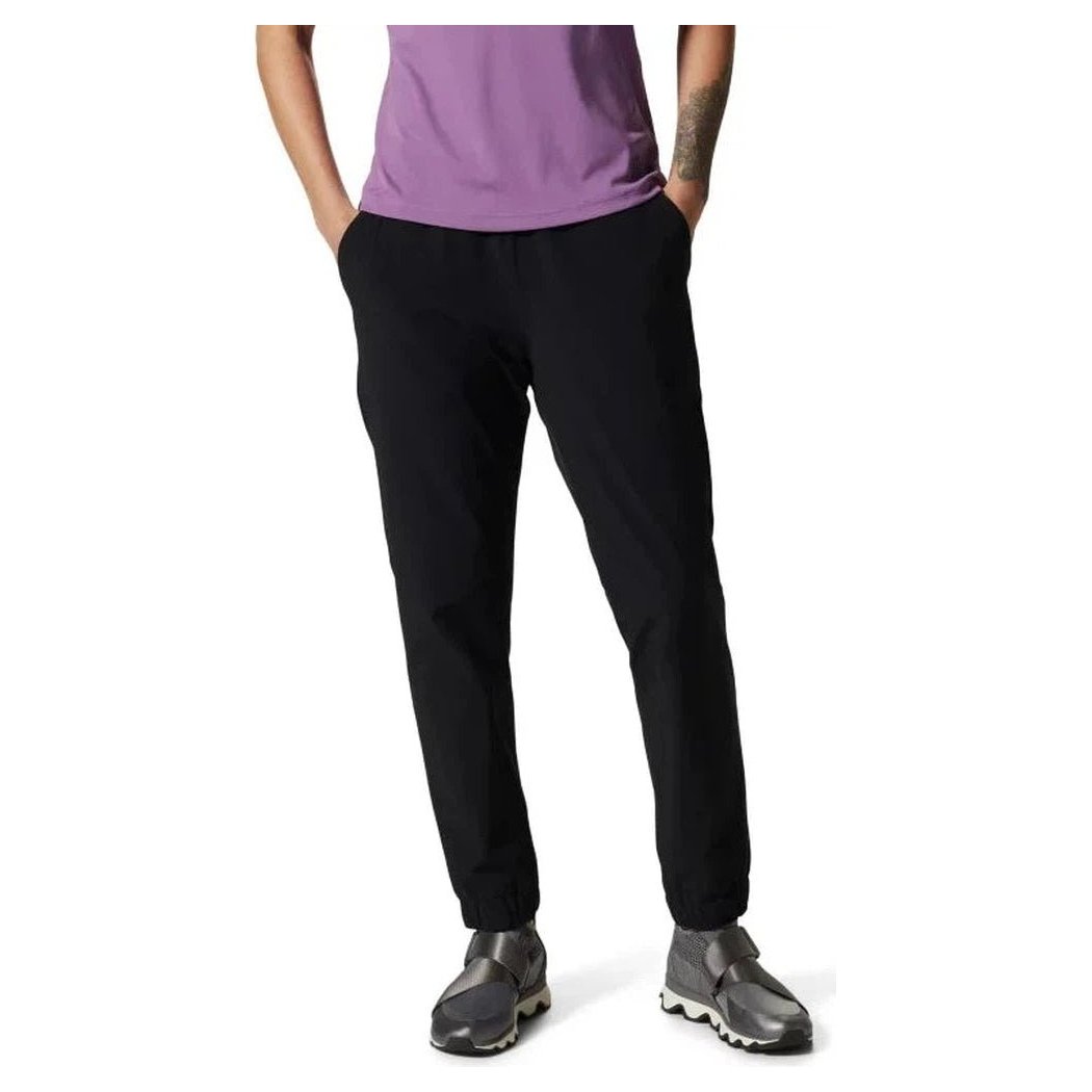 A front view of the Mountain Hardwear Women's Yumalina Active Pull-On Lined Jogger in Black, showing the model wearing it with hands in pockets against a white background.
