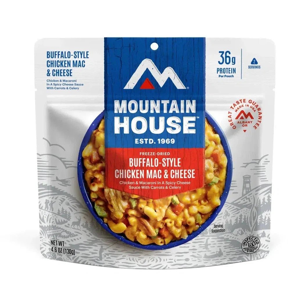 A front view of the Mountain House Buffalo Style Chicken Mac and Cheese showing the freeze-dried meal in a blue bowl with a white background.