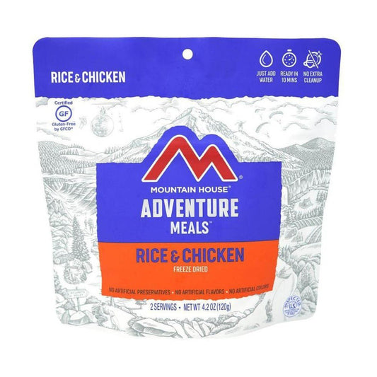 A front view of the Mountain House Rice & Chicken freeze dried backpacking meal package showing the blue and orange label and mountain illustration.