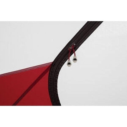 The MSR Elixir 1 tent’s charcoal zipper pull with white beads is shown against a white background.