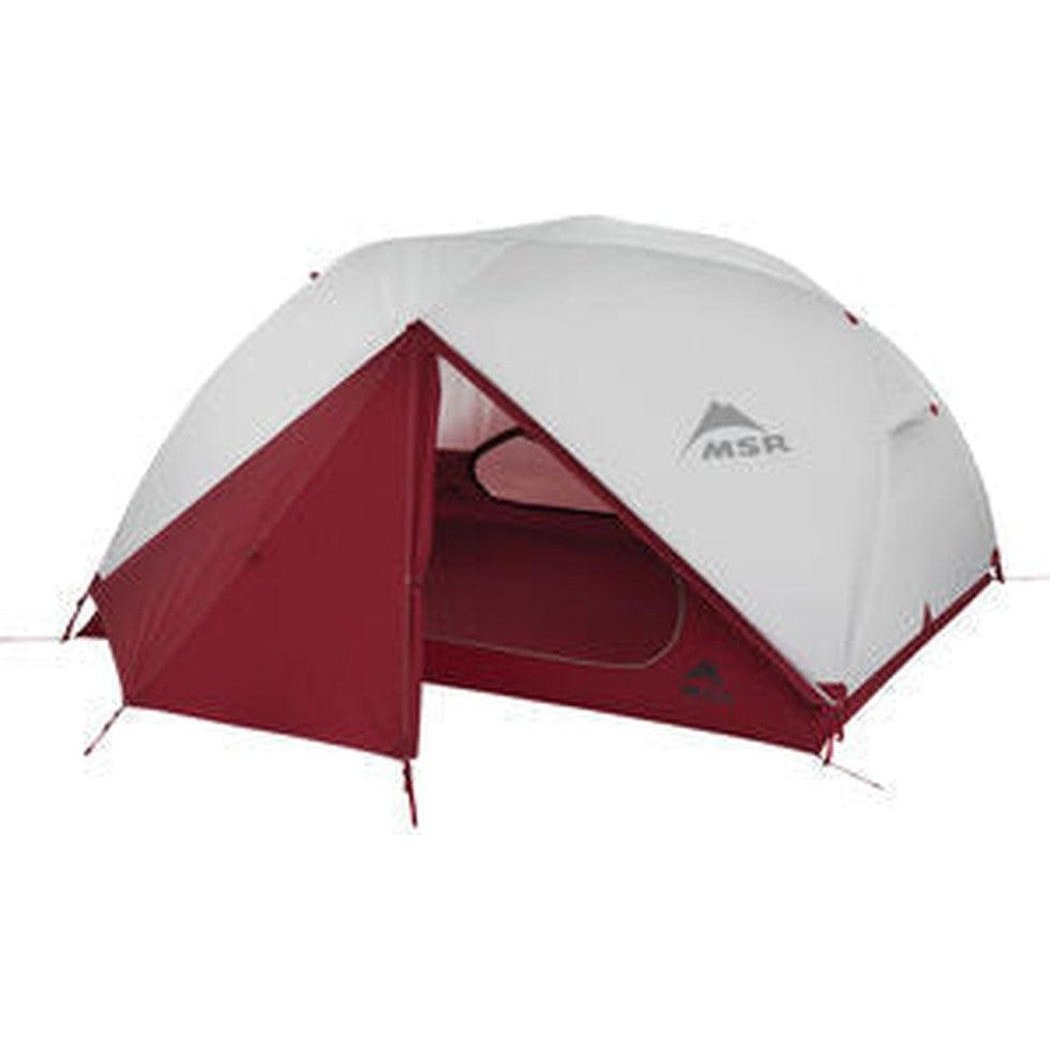 A front view of the MSR Elixir 3 Tent V2 with its red door open, set against a plain white background.