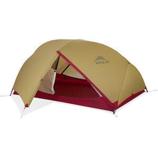 A side view of the MSR Hubba Hubba 2 Tent V9 showing the open entrance and red floor against a white background.