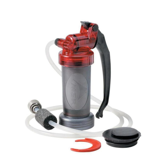 A front view of the MSR MiniWorks EX water filter with its black handle and red top, showing the attached hose and filter head against a white background.