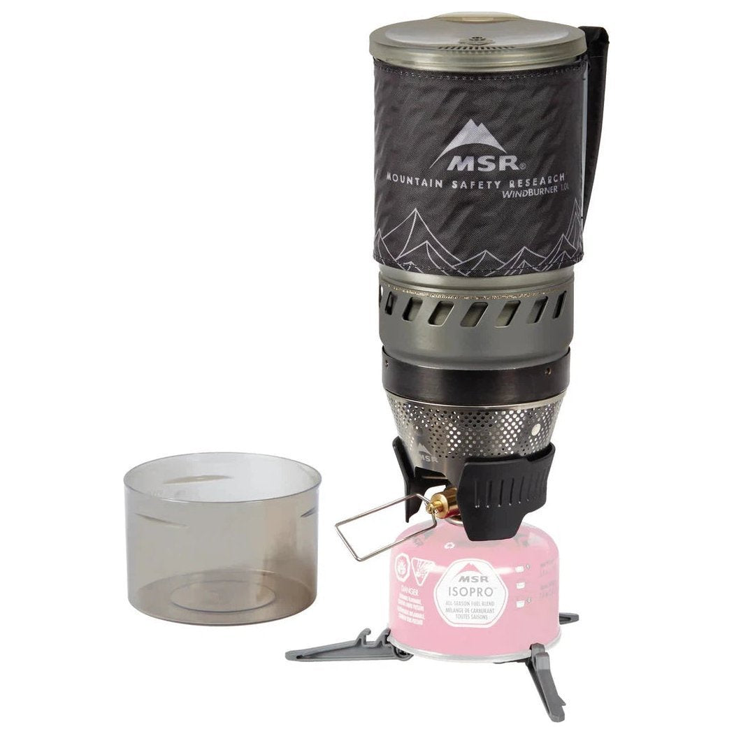 A top-down view of the MSR WindBurner Personal Stove System in Black with a pink fuel canister and a clear pot on a white background.