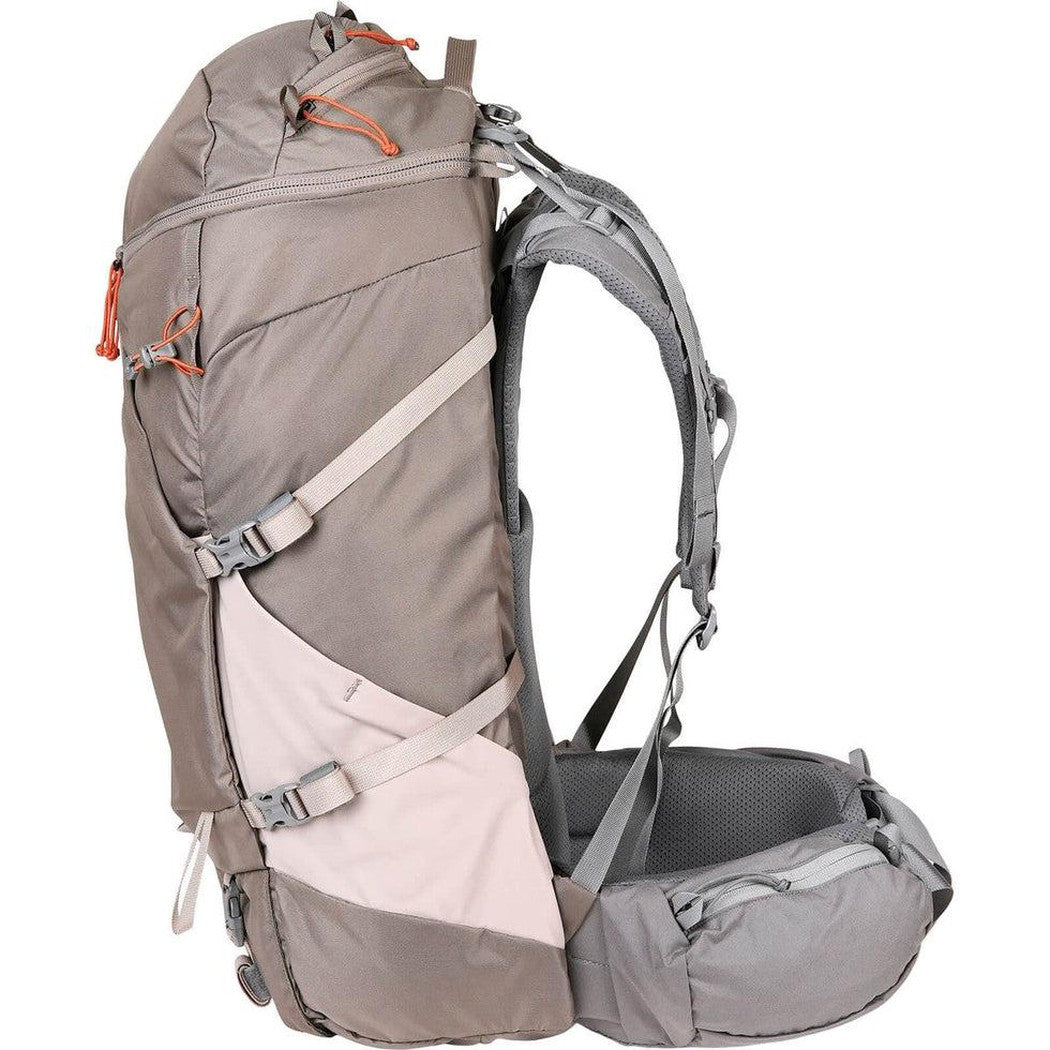 Side view of the Mystery Ranch Backpacks Women's Coulee 50 in Pebble showing the hip belt and shoulder straps against a white background.
