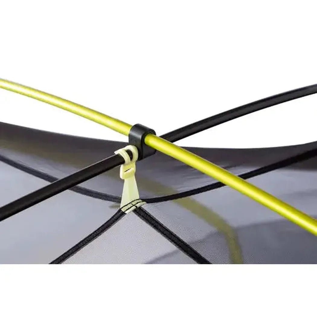 A close-up of the NEMO Dagger OSMO Lightweight Backpacking 2p Tent showing the yellow and black frame against a gray background.