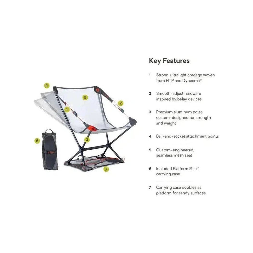 A side view of the NEMO Moonlite Elite Reclining Camp Chair in Black showing its strong, ultralight cordage and included carrying case against a white background.