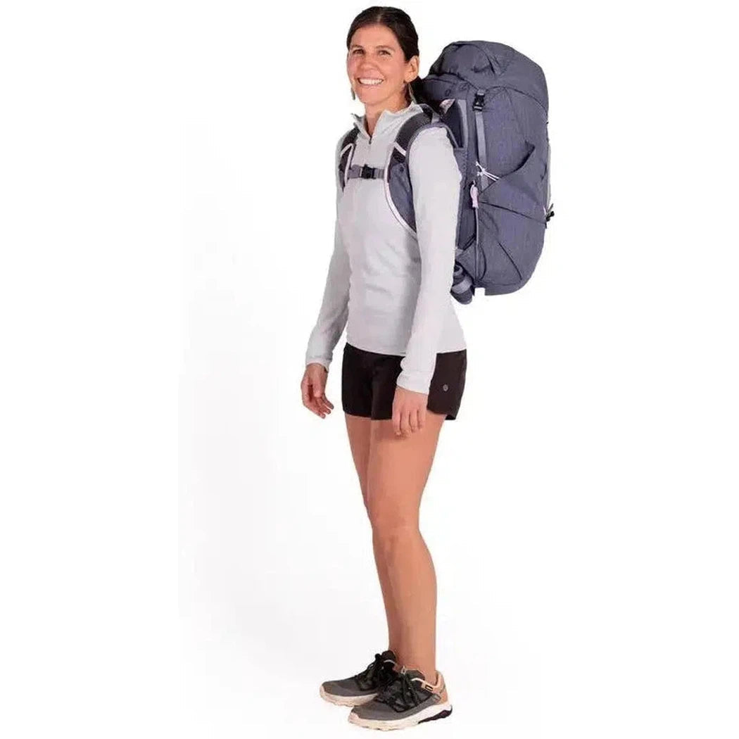 Side view of the NEMO Resolve Womens 35L Endless Promise backpack in Blue Granite on a model against a white background.