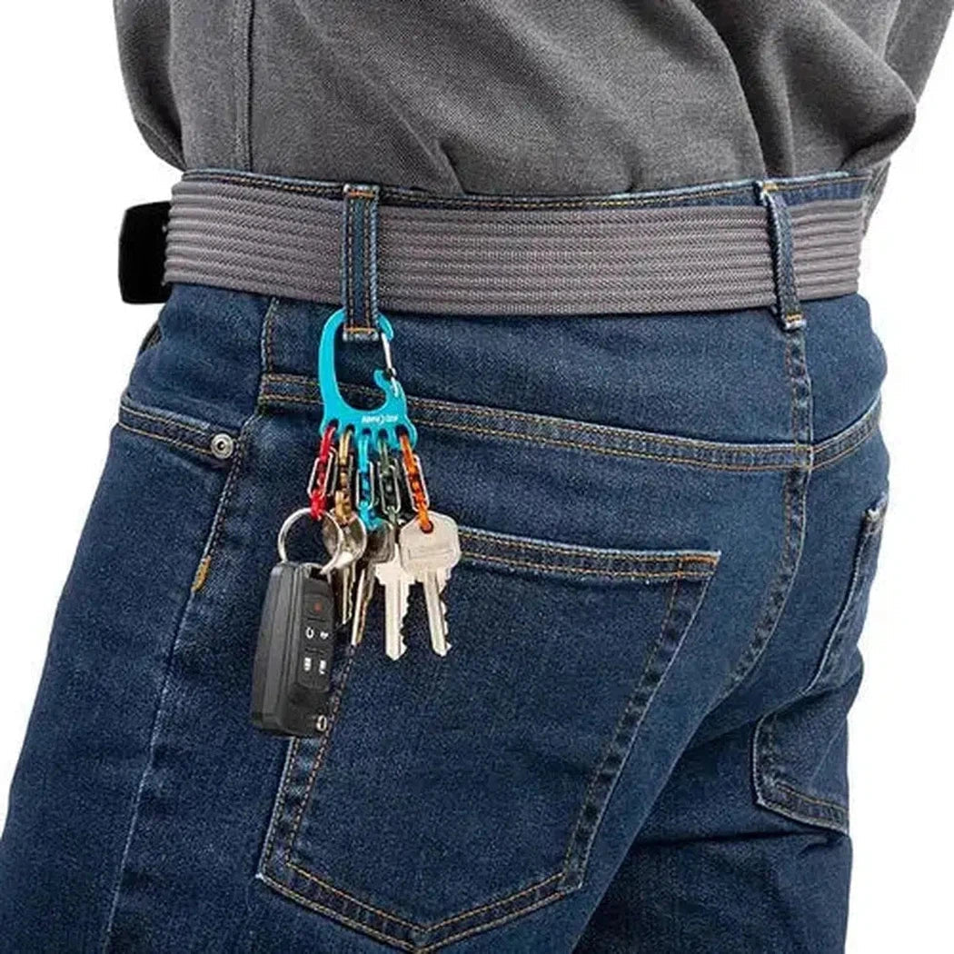 Back view of the Nite Ize BigFoot Locker KeyRack Aluminum on a model wearing blue jeans with a charcoal/gray belt.