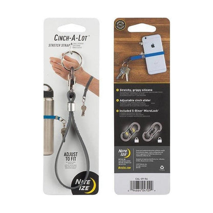 Back of Nite Ize Cinch-A-Lot Stretch Strap packaging showing a white iPhone with a blue strap and keys, plus features.