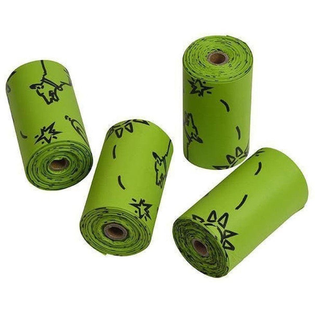 Four green Nite Ize Pack-a-poo Dispenser rolls with black designs, lying on a white background.