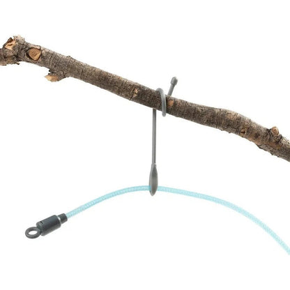 A close-up of the Nite Ize Radiant Rechargeable ShineLine in Blue/Blue, showing the blue cord and metal hook attached to a branch against a white background.